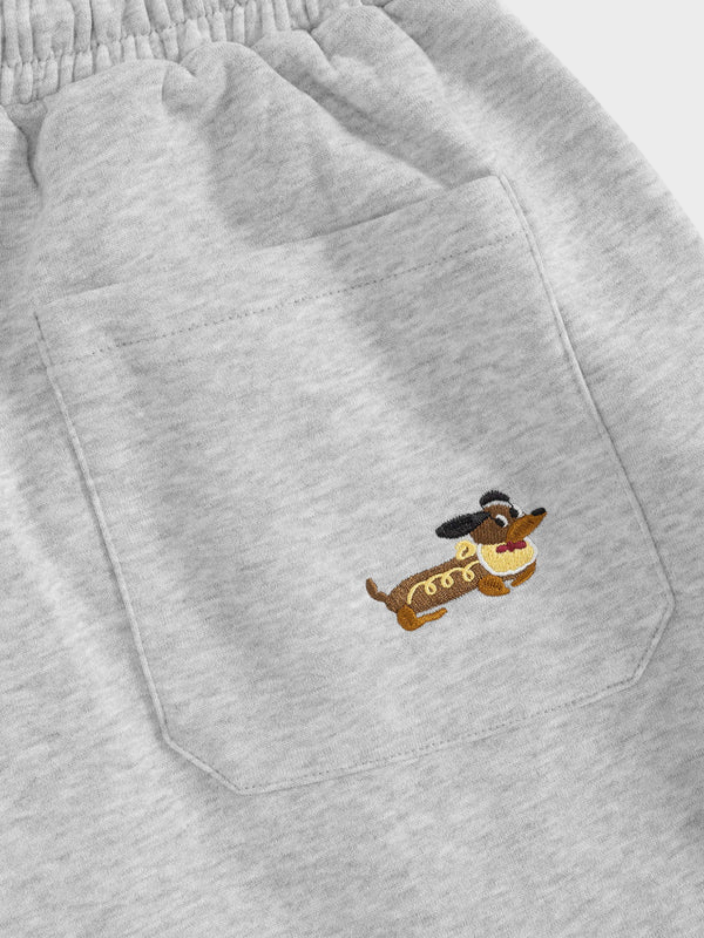 Carol | Pantalones de chándal barrel con perritos bordados