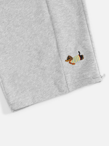 Carol | Pantalones de chándal barrel con perritos bordados