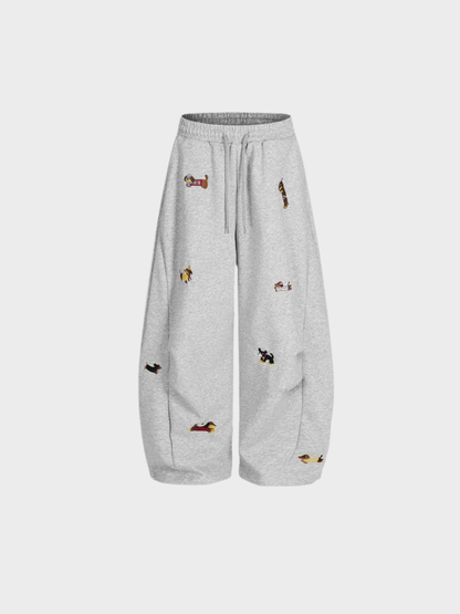 Carol | Pantalones de chándal barrel con perritos bordados
